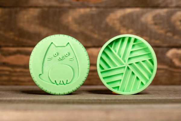 A green plastic 3d printed grinder for catnip