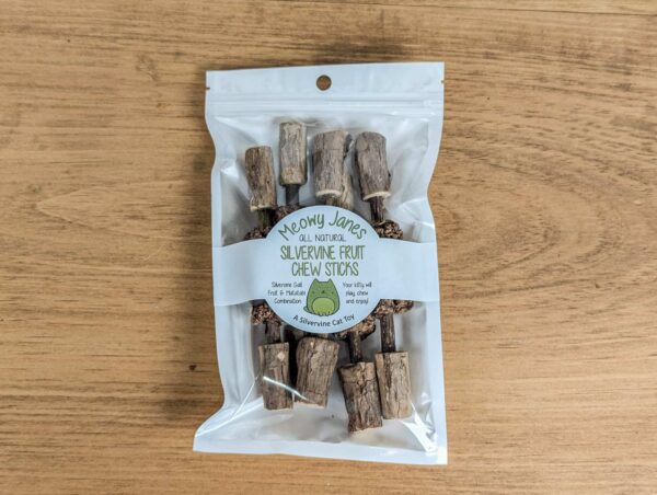 A bag of matatabi sticks with silvervine fruits and matatabi stick end caps attached