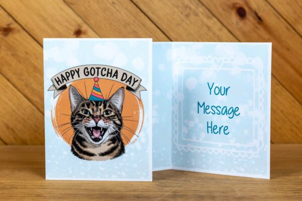 A greeting card with a cat and the text "Happy Gotcha Day" on the front